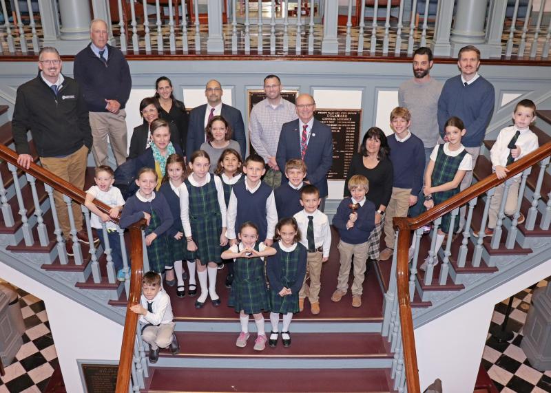 Legacy Academy students, staff, and families join Rep. Jeff Hilovsky on the steps in Legislative Hall. Shown are in back (l-r) Legacy board members Duane Smith and Greg Louden; grammar teacher Cally McCullough; Legacy family members Marisol Gladding, Kevin Gladding, Ryan Gerrick and Justin Stevenson; and Josh Brittingham, dean of students and logic teacher. In the third row are Karen Barbrow, Legacy head of school; Legacy family member Joan Clifton; Hilovsky; and grammar teacher Susan Louden. In the second row are Legacy family member Parker Stevenson and students Anna Louden, Olivia Parks, Paige Barbrow, Sofia Gladding, Lane Barbrow, Finn Louden, Nathan Gerrick, Samuel Louden, Jack Louden, Layla Stevenson and Nathan Parks. In front are students Kai Gladding, Sophia Stevenson and Angel Clifton. SUBMITTED PHOTOS